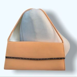 Peach colored clutch purse